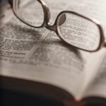 tilt-shift photography of eyeglasses with silver-colored frames